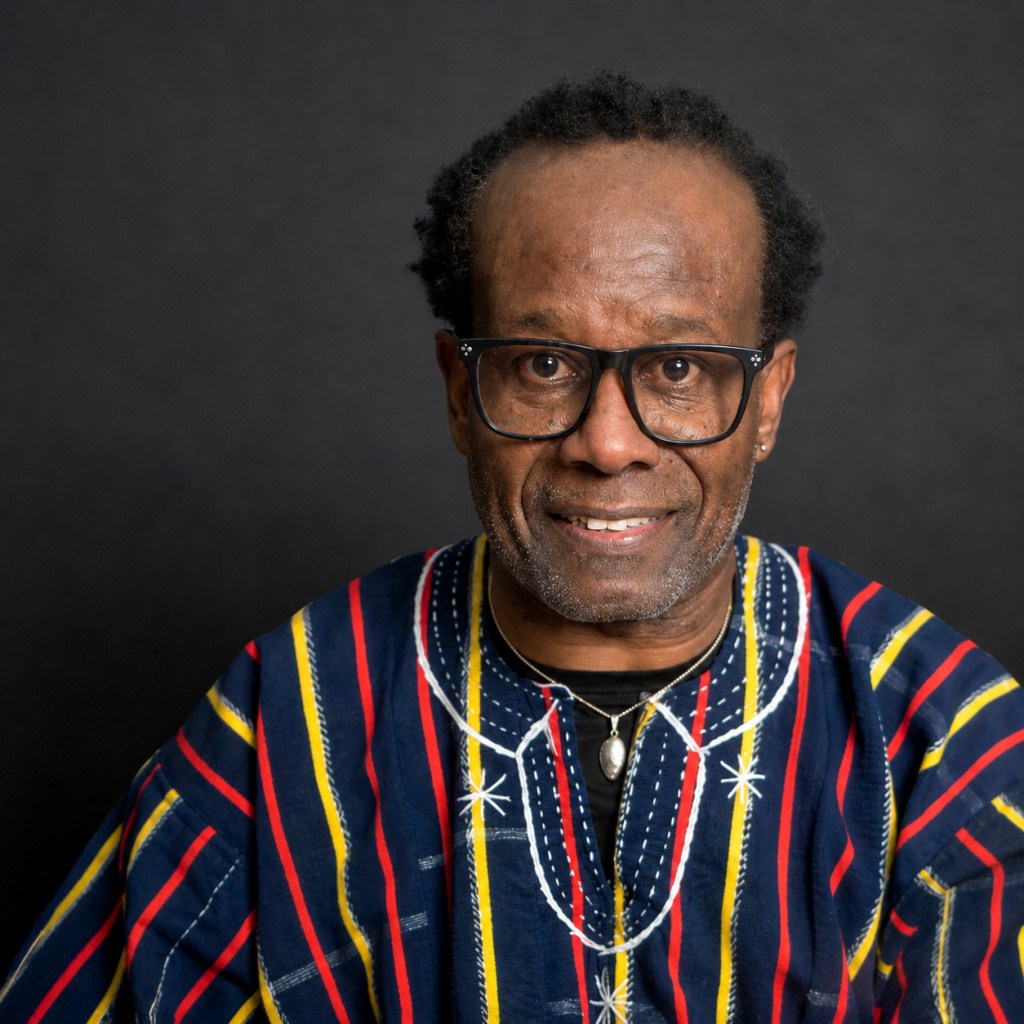 Portrait of Dr. Omowale Elson, Founder and Chief Strategist of ECG Edge Academy and creator of the Pan-African Caribbean Youth Leadership Workshop.